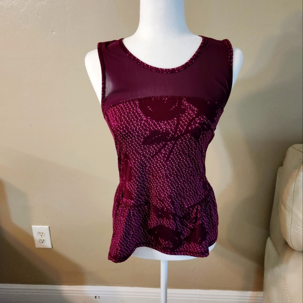 Athletic sleeveless top. See threw mesh at top on back